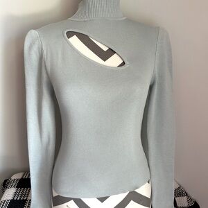 Mint green/blue colored long sleeve top with cut out neck